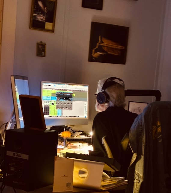 Tom Schueneman editing a podcast in his home studio